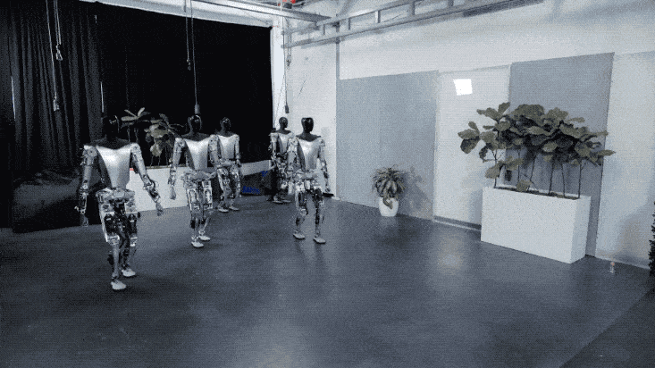 特斯拉人形机器人集体出街!马斯克:比车便宜,会有100亿台