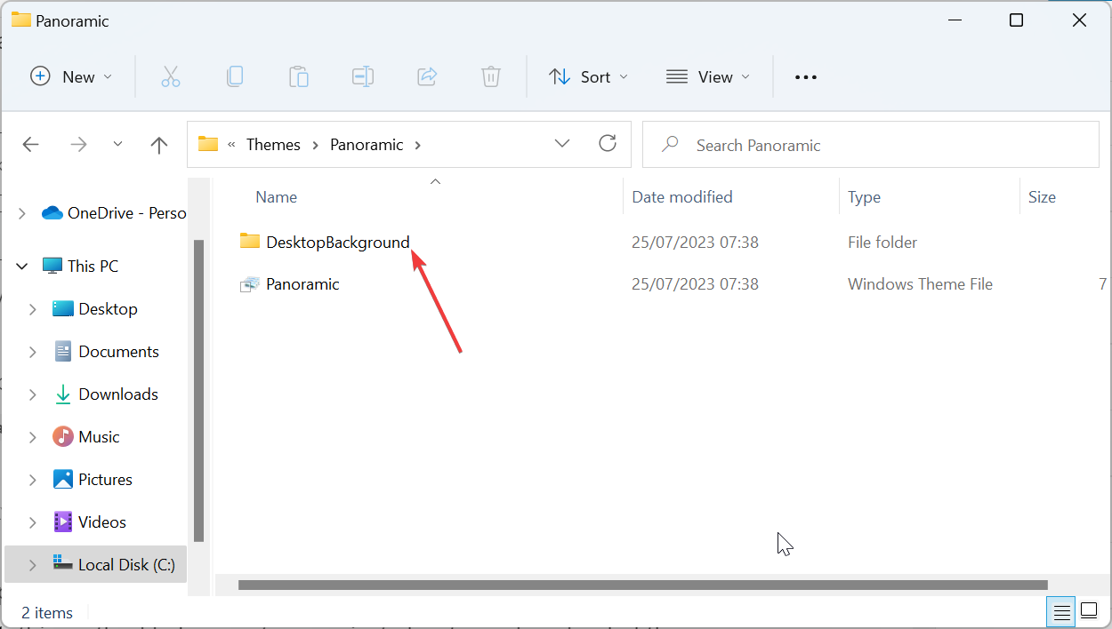 主题背景位于 Windows 11 中的什么位置?